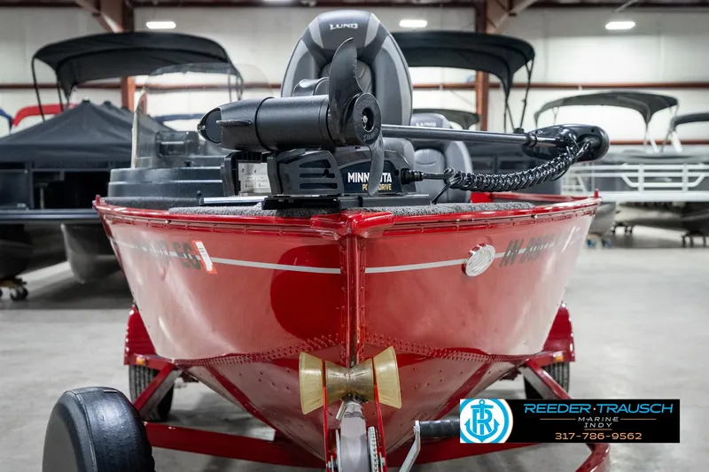 Slide: The Image of 2021 Lund 1650 ANG SS boat in showroom, featuring Minn Kota motor. - 3