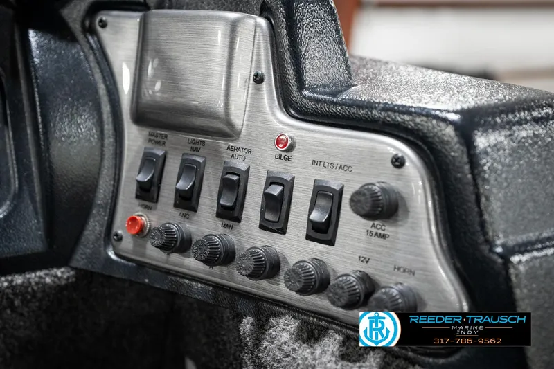 Slide: The Image of Control panel of 2021 Lund 1650 ANG SS boat with switches and knobs. - 30