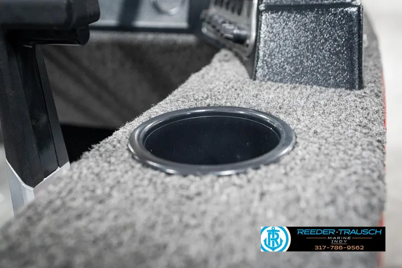 Slide: The Image of Cup holder in 2021 Lund 1650 ANG SS boat interior, featuring carpeted surface. - 32