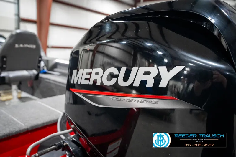 Slide: The Image of Mercury FourStroke engine on 2021 Lund 1650 ANG SS boat in a showroom. - 38