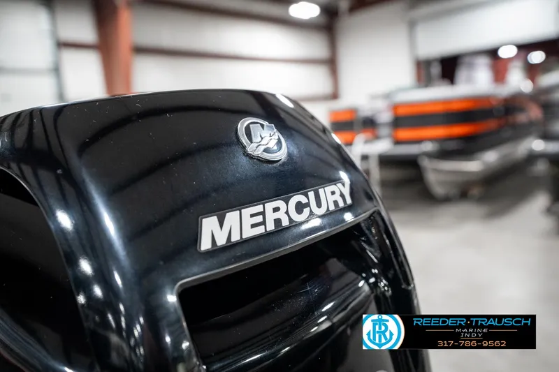 Slide: The Image of Mercury outboard motor on 2021 Lund 1650 ANG SS boat in showroom. - 39