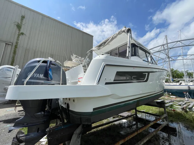 Slide: The Image of 2022 Jeanneau NC 695 Series 2 anchor compartment with chain and winch. - 23