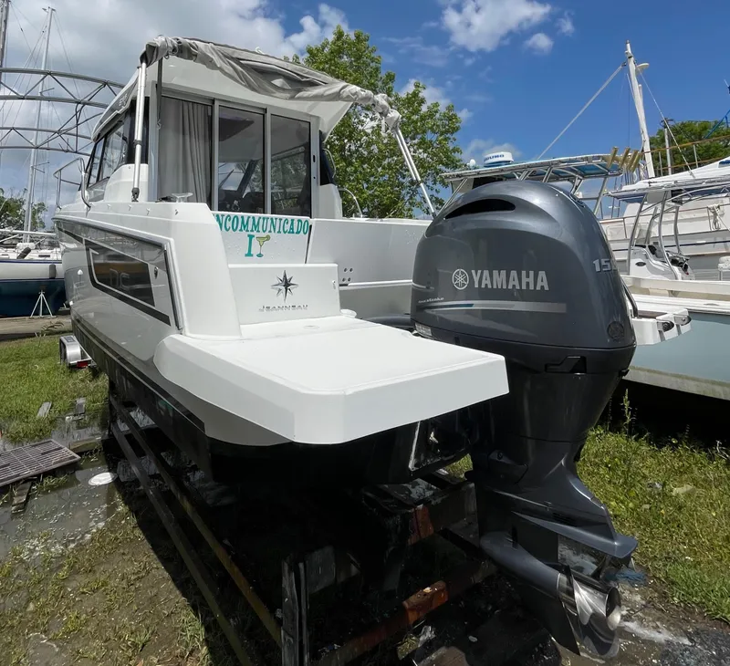 Slide: The Image of 2022 Jeanneau NC 695 Series 2 boat with Yamaha 150 engine, docked outdoors. - 25