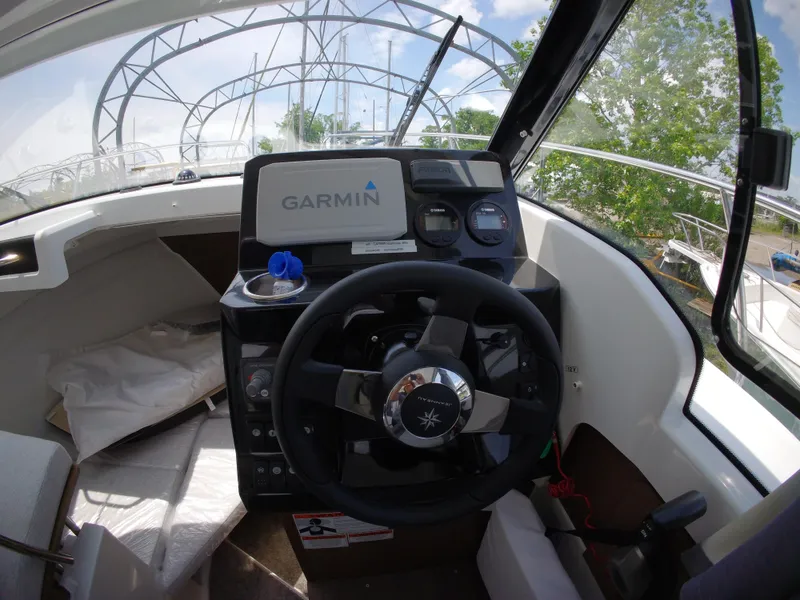 Slide: The Image of Interior of 2022 Jeanneau NC 695 Series 2 boat with Garmin navigation system. - 5