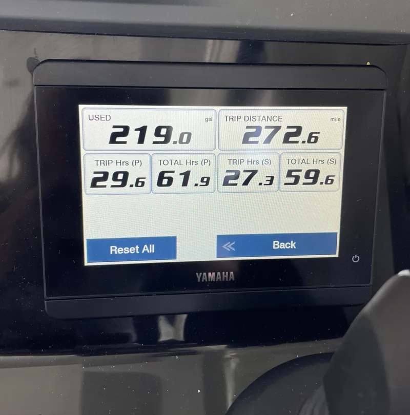 Slide: The Image of 2022 Jeanneau NC 695 Series 2 helm with Garmin navigation system and modern controls. - 7