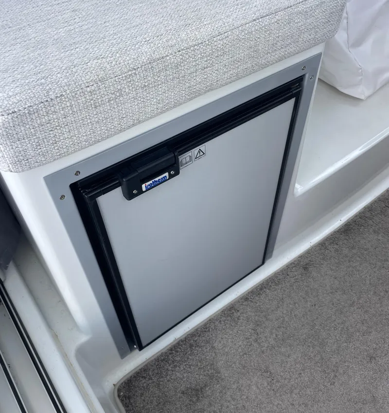 Slide: The Image of Interior of 2022 Jeanneau NC 695 Series 2 boat with seating and table. - 9