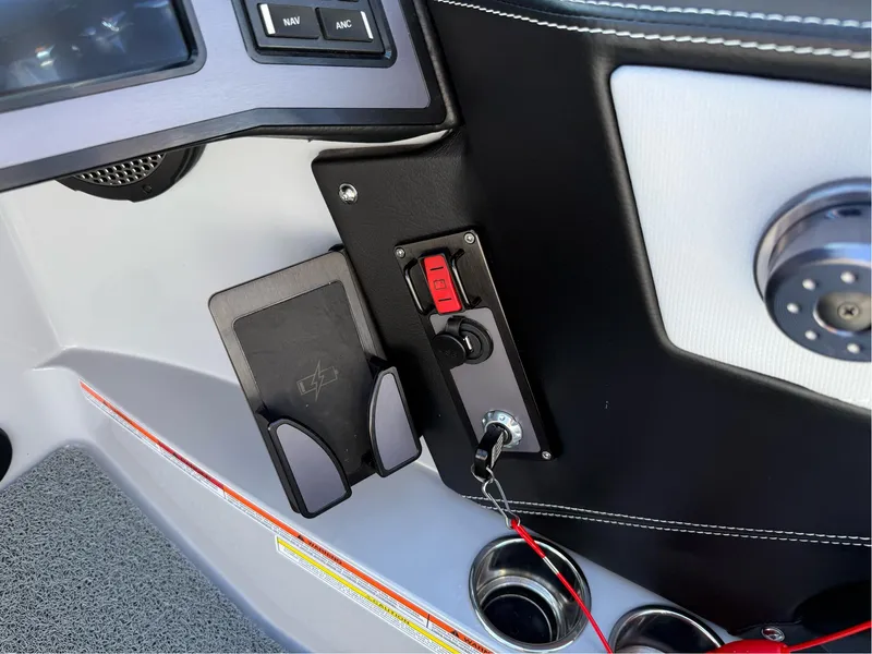 Slide: The Image of 2024 MasterCraft XStar S dashboard with controls and cup holders. - 15