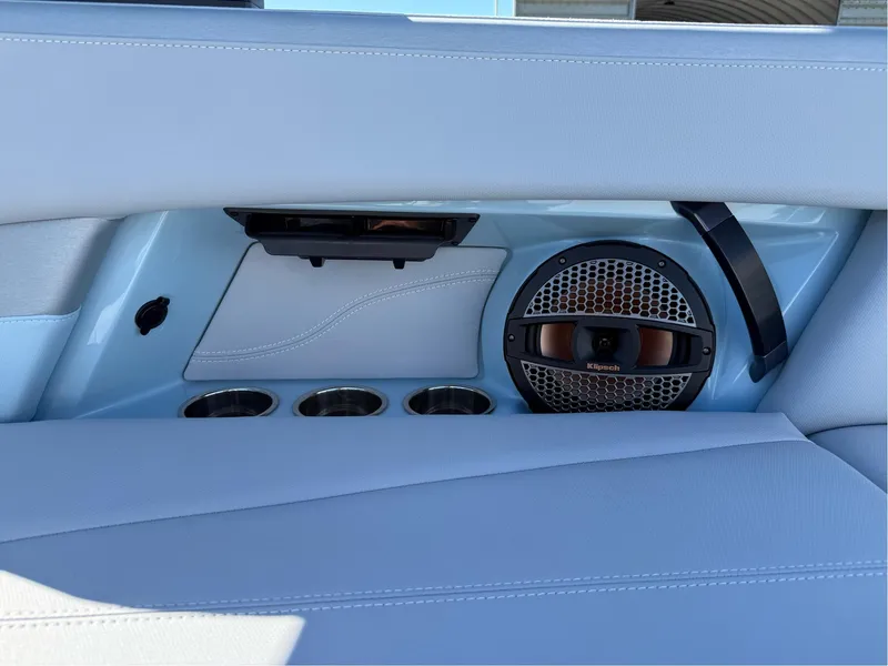 Slide: The Image of 2024 MasterCraft XStar S interior with speaker and cup holders. - 19