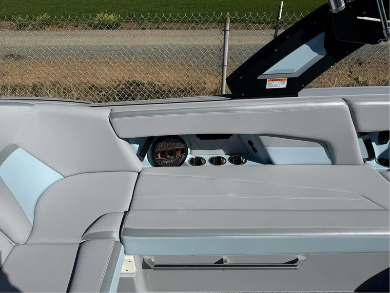 Slide: The Image of 2024 MasterCraft XStar S interior with sleek gray seating and modern design elements. - 23