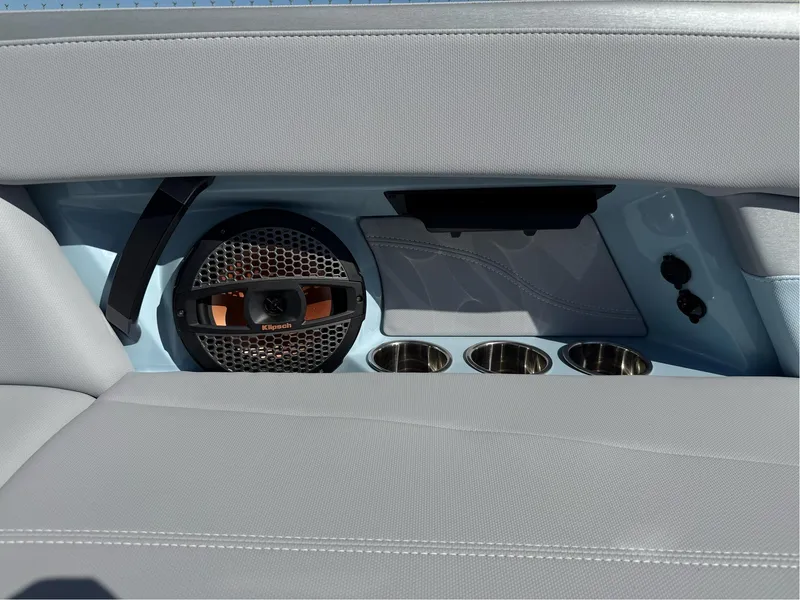 Slide: The Image of 2024 MasterCraft XStar S interior with speaker and cup holders. - 24