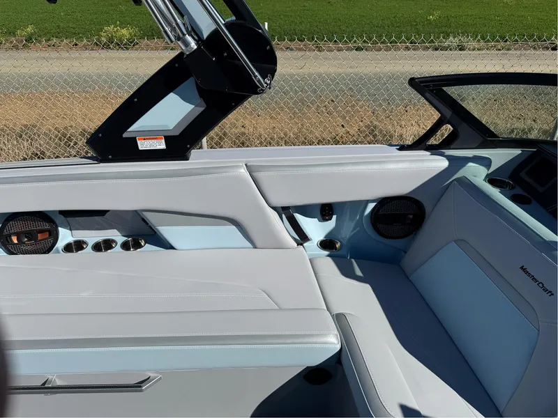 Slide: The Image of 2024 MasterCraft XStar S boat interior with sleek seating and modern design. - 25