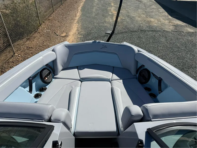 Slide: The Image of 2024 MasterCraft XStar S boat interior with spacious seating and modern design. - 28