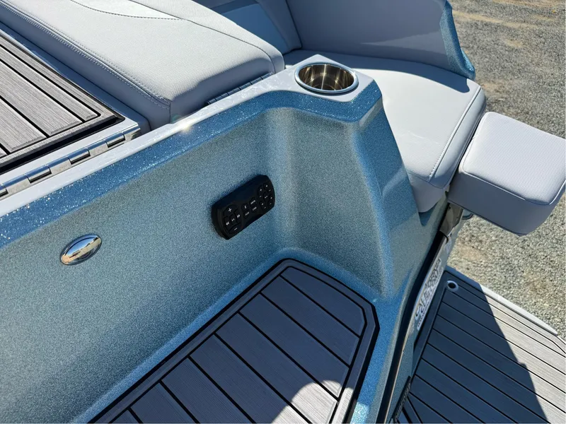 Slide: The Image of 2024 MasterCraft XStar S boat interior with cup holder and seating detail. - 38