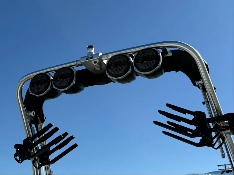 Slide: The Image of 2024 MasterCraft XStar S wakeboard tower with speakers against clear blue sky. - 39
