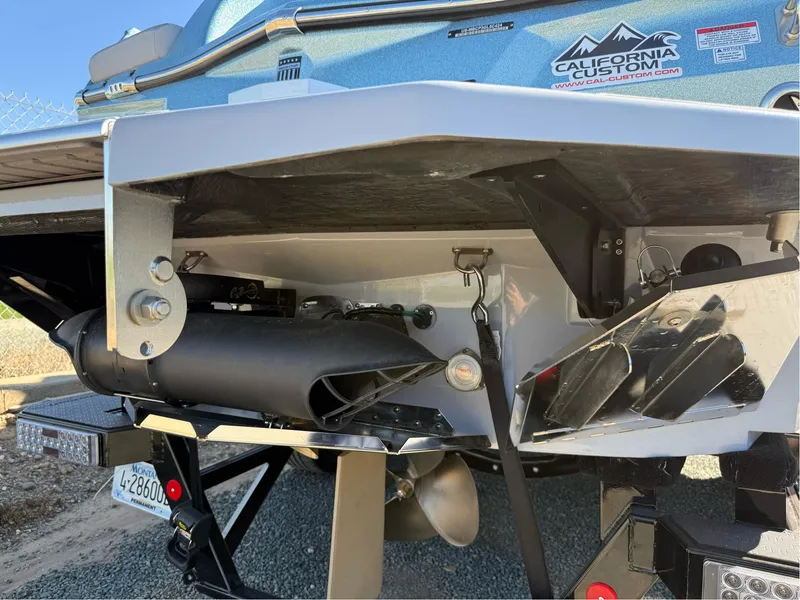 Slide: The Image of 2024 MasterCraft XStar S boat stern with propeller and California Custom decal. - 40