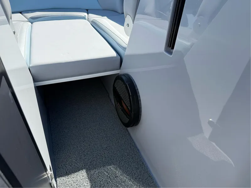 Slide: The Image of 2024 MasterCraft XStar S interior with cushioned seating and speaker detail. - 43