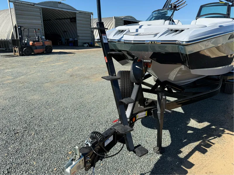 Slide: The Image of 2024 MasterCraft XStar S boat on trailer in outdoor storage area. - 8
