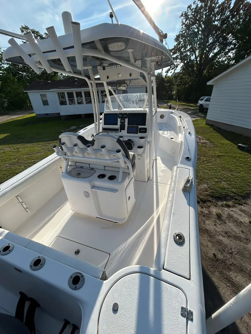 Slide: The Image of 2015 Tidewater 250 CC Adventure boat with dual consoles and fishing rod holders. - 8