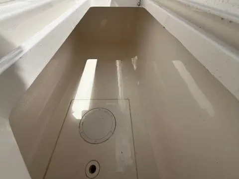 Slide: The Image of 2022 Invincible 33 Catamaran storage compartment, featuring a clean, spacious interior. - 13