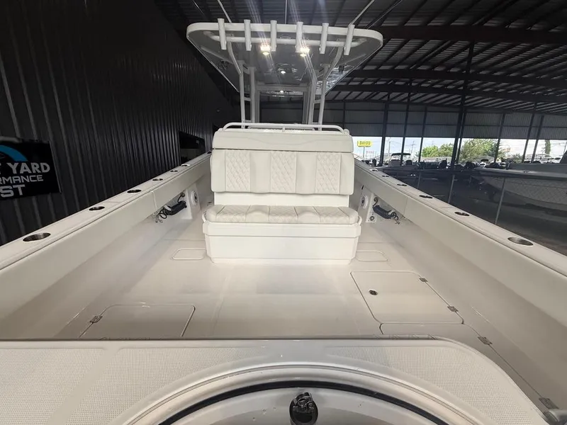 Slide: The Image of 2022 Invincible 33 Catamaran interior with seating, under a metal roof. - 18