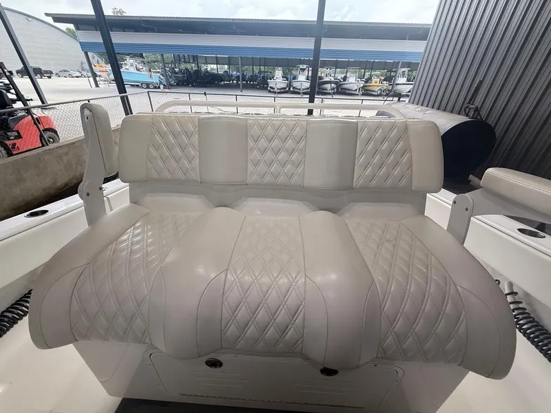 Slide: The Image of Luxurious seating on 2022 Invincible 33 Catamaran, featuring diamond-stitched upholstery. - 27
