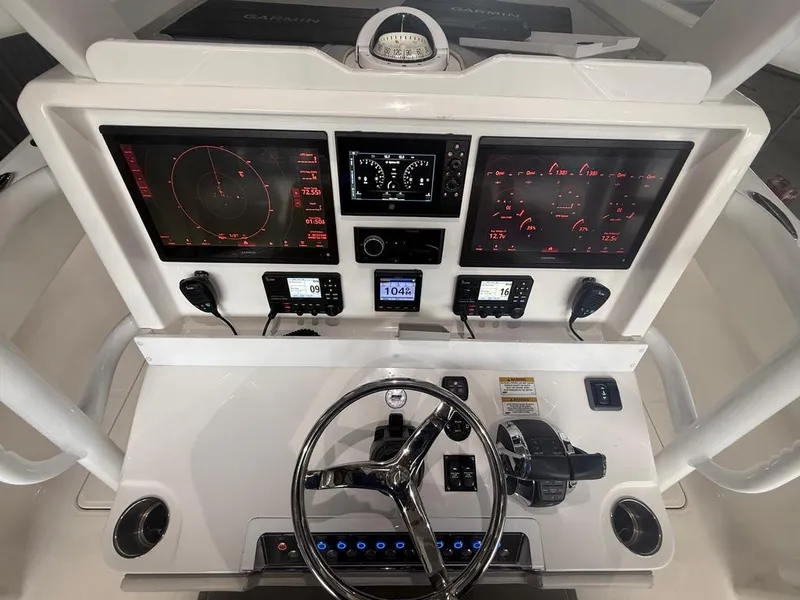 Slide: The Image of Cockpit of 2022 Invincible 33 Catamaran with advanced navigation and control systems. - 28