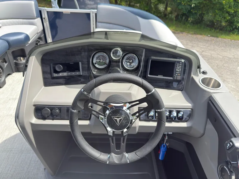 Slide: The Image of 2025 Tahoe LTZ Quad Lounger 23 dashboard with steering wheel and control panel. - 7