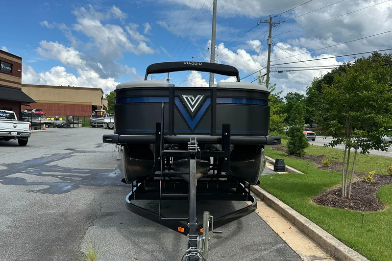 Slide: The Image of Front view of 2025 Viaggio Lago X-S boat on trailer, parked outdoors. - 1