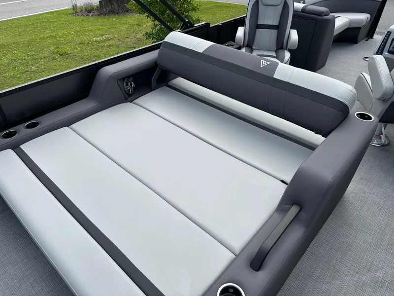 Slide: The Image of Luxurious seating on 2025 Viaggio Lago X-S boat, featuring sleek gray upholstery and cup holders. - 10