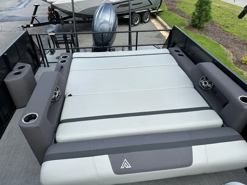 Slide: The Image of Luxurious seating area on 2025 Viaggio Lago X-S boat with cup holders and speakers. - 11