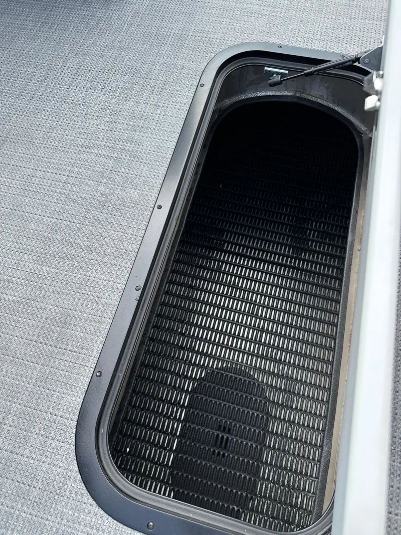 Slide: The Image of Open storage compartment on 2025 Viaggio Lago X-S boat deck. - 14