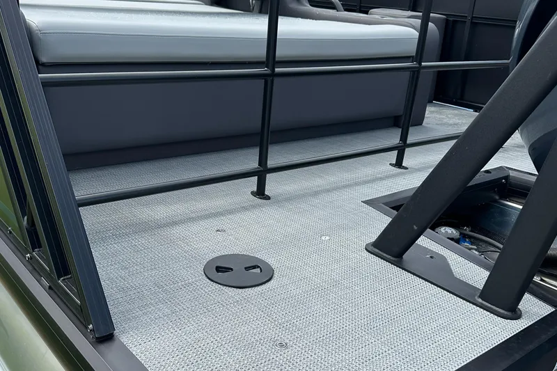 Slide: The Image of 2025 Viaggio Lago X-S boat interior with gray seating and textured flooring. - 15