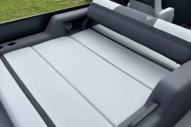 Slide: The Image of 2025 Viaggio Lago X-S boat interior with spacious, cushioned seating in gray tones. - 16