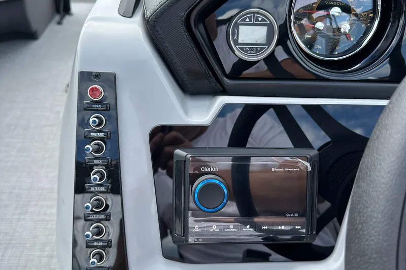 Slide: The Image of Dashboard of 2025 Viaggio Lago X-S with control panel and Clarion audio system. - 17