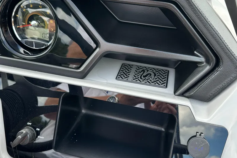 Slide: The Image of Dashboard of 2025 Viaggio Lago X-S with speedometer and storage compartments. - 18