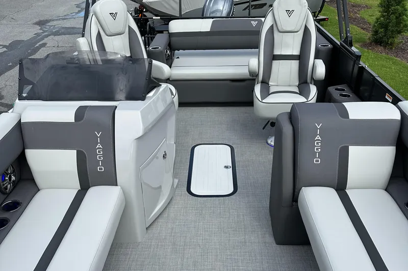 Slide: The Image of 2025 Viaggio Lago X-S boat interior with gray and white seating, modern design, and spacious layout. - 23