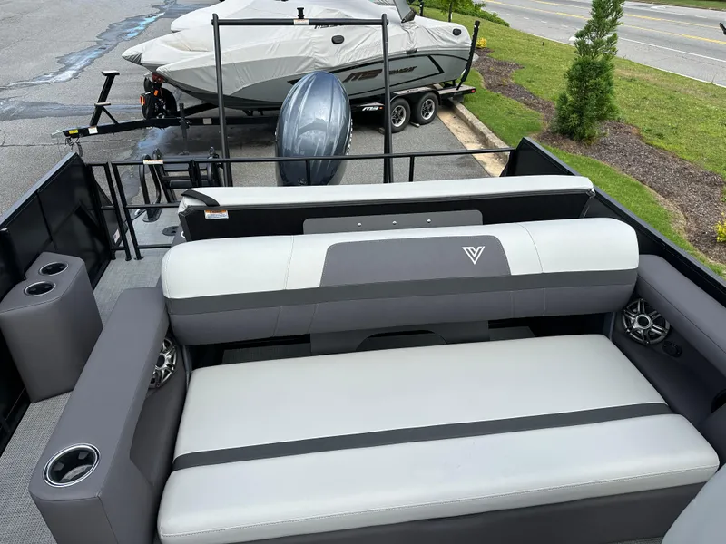 Slide: The Image of 2025 Viaggio Lago X-S boat interior with cushioned seating and cup holders. - 8