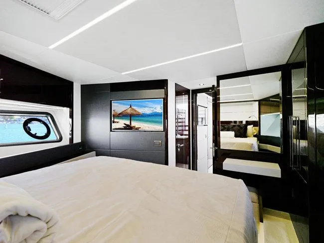 Slide: The Image of Luxurious bedroom interior of 2018 Sunseeker Predator 74 yacht with modern design and scenic window view. - 23