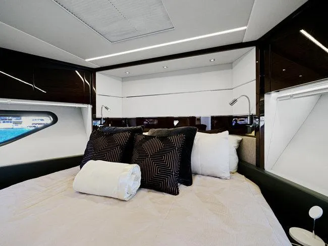 Slide: The Image of Luxurious bedroom interior of 2018 Sunseeker Predator 74 yacht with modern design and plush bedding. - 22