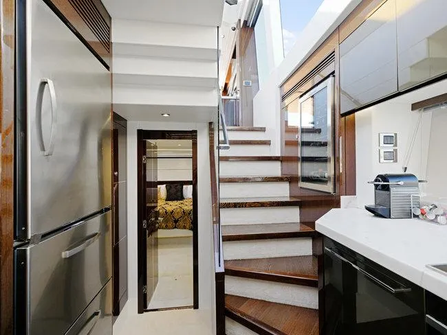 Slide: The Image of Luxurious interior of 2018 Sunseeker Predator 74 yacht with modern kitchen and staircase. - 26