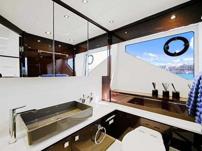 Slide: The Image of Luxurious bathroom on 2018 Sunseeker Predator 74 yacht, featuring modern fixtures and ocean view. - 40