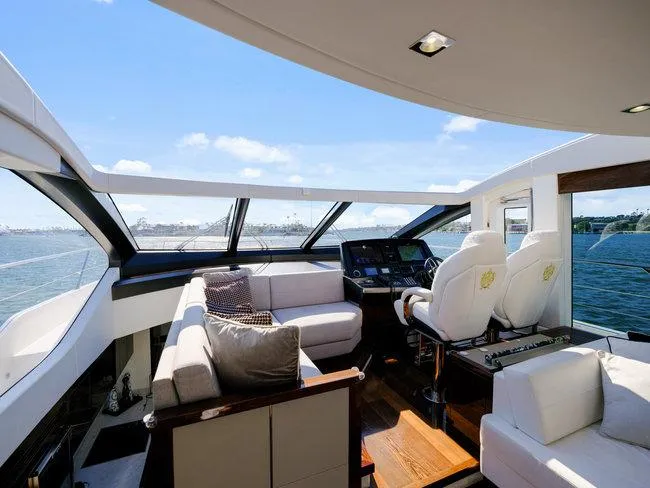 Slide: The Image of Luxurious interior of 2018 Sunseeker Predator 74 yacht with panoramic windows and plush seating. - 49