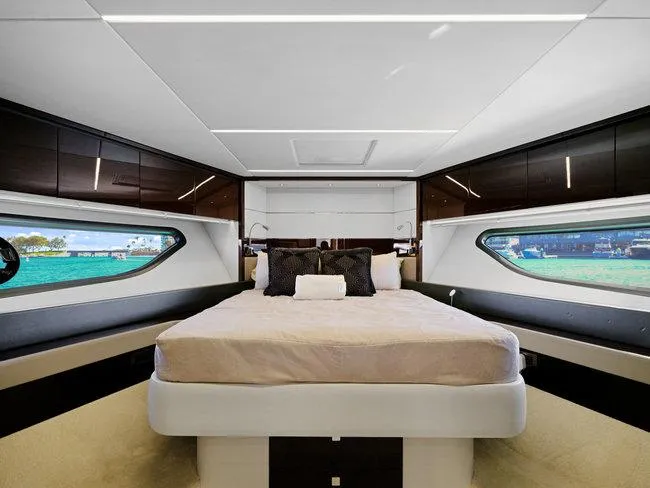 Slide: The Image of Luxurious bedroom interior of 2018 Sunseeker Predator 74 yacht with modern design and large windows. - 20