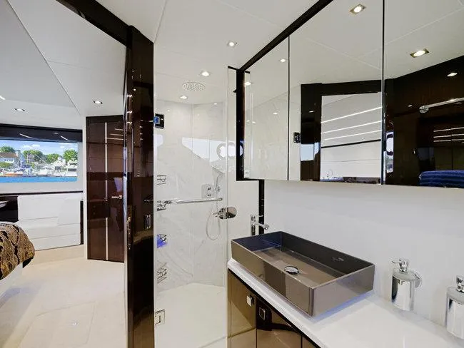 Slide: The Image of Luxurious bathroom interior of 2018 Sunseeker Predator 74 yacht, featuring modern fixtures and sleek design. - 41