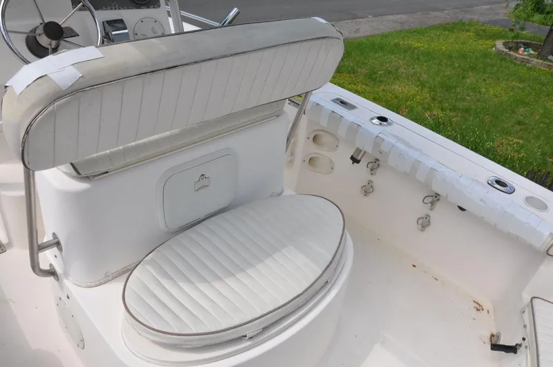 Slide: The Image of 2003 Trophy 1903 Center Console boat interior with white seating and console details. - 12