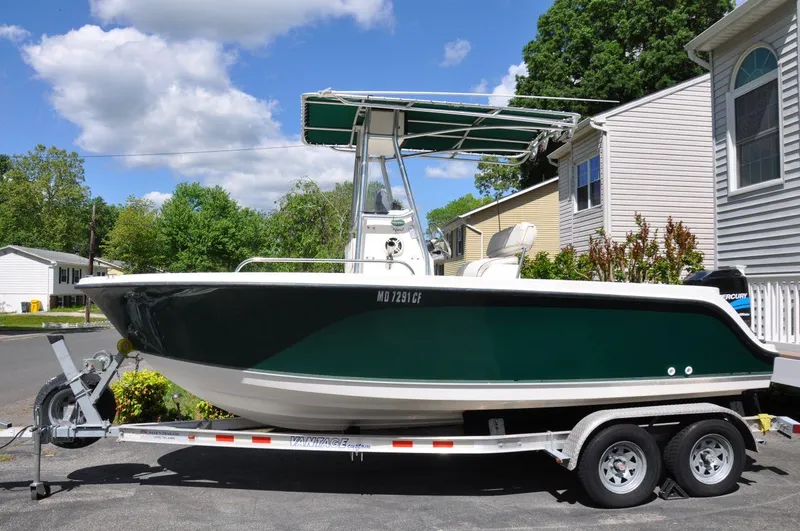 Slide: The Image of 2003 Trophy 1903 Center Console boat on trailer, parked in residential area. - 3