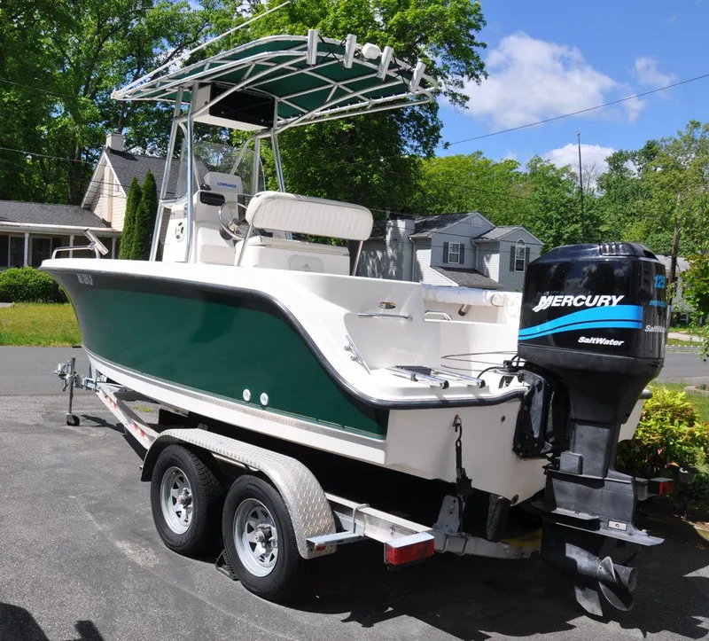 Slide: The Image of 2003 Trophy 1903 Center Console boat on trailer with Mercury outboard engine. - 4