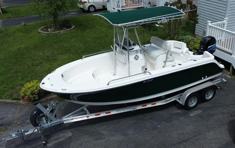 Slide: The Image of 2003 Trophy 1903 Center Console boat on trailer, parked in driveway. - 5