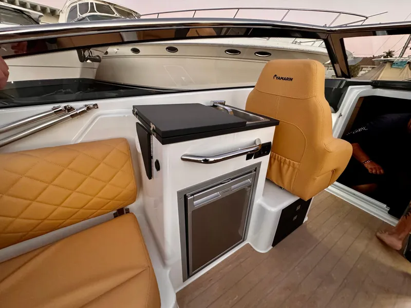 Slide: The Image of Luxurious interior of 2023 Yamarin 88 DC boat with tan seating and modern amenities. - 15
