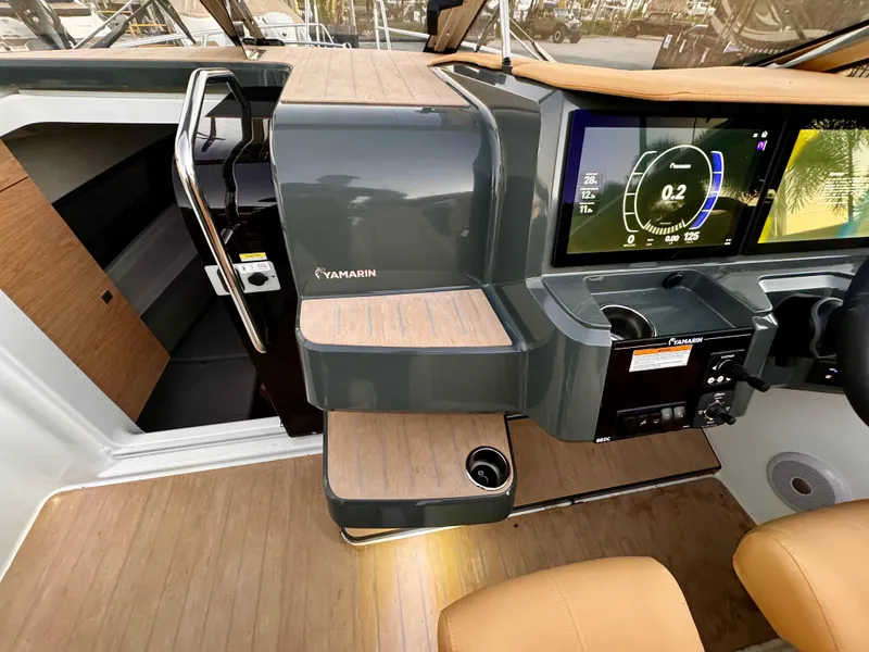 Slide: The Image of 2023 Yamarin 88 DC boat interior with modern dashboard and navigation display. - 19